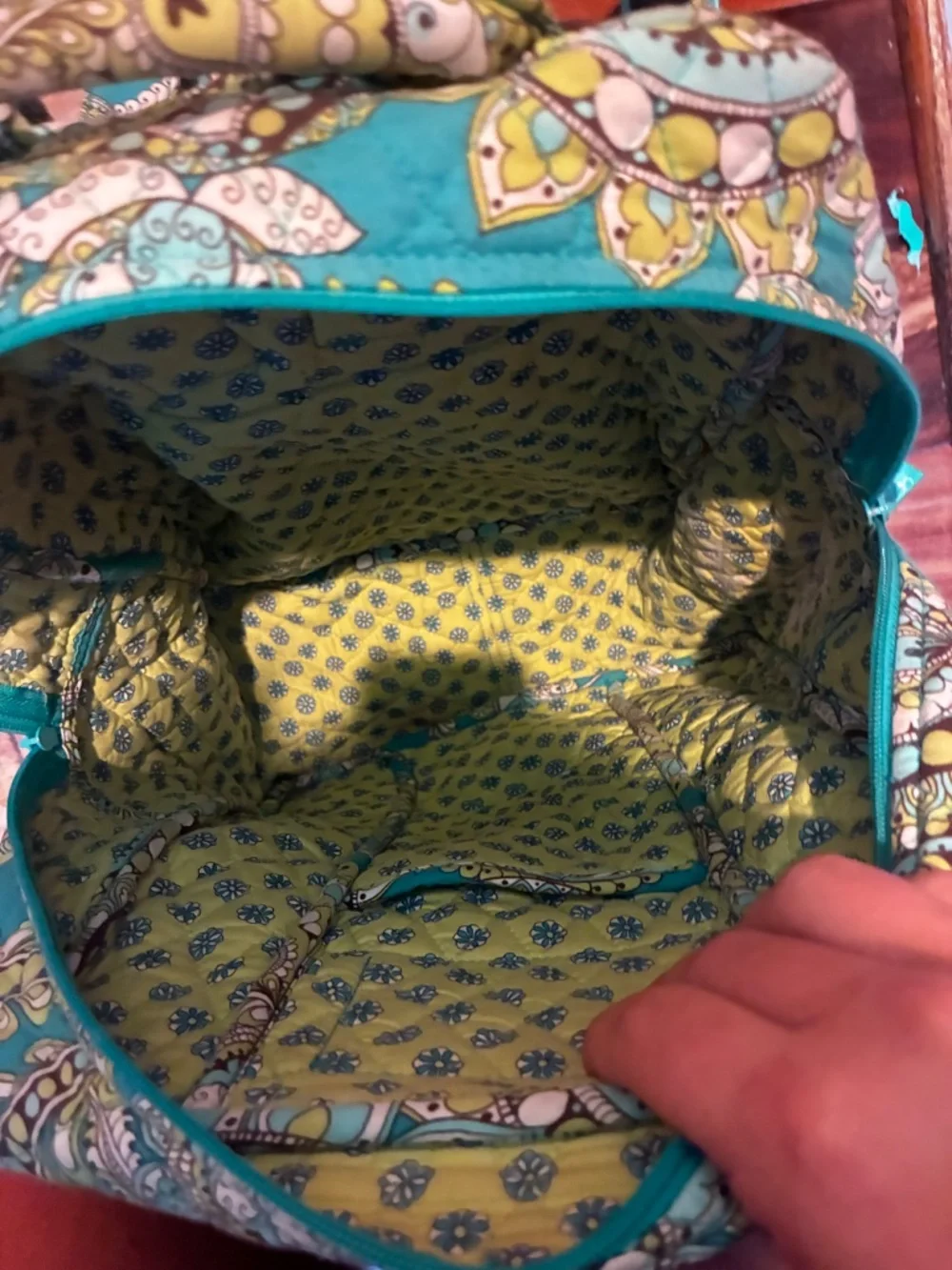 Peacock green Vera Bradley backpack with little necessity pouch